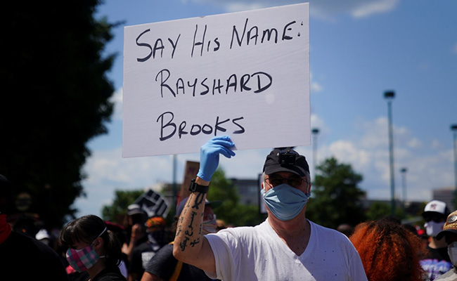 Atlanta Cop Charged With Murder For Shooting Black Man Surrenders To Authorities