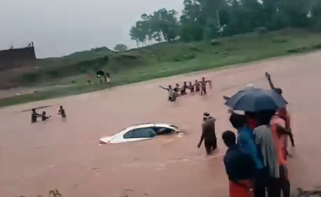 Watch: Locals Jump Into River To Save Newlywed Couple In A Half-Sunk Car