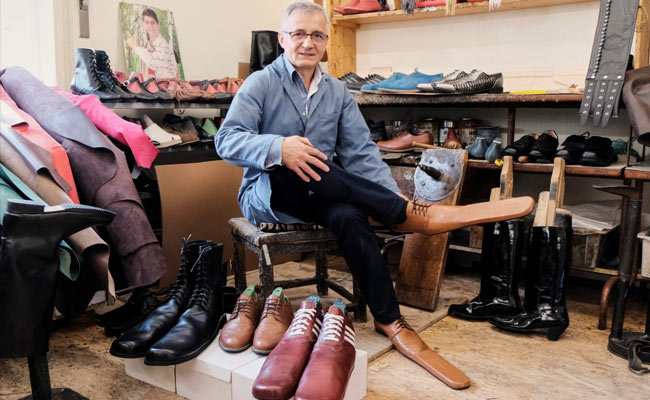 Romanian Cobbler Keeps People Apart With Size 75 Shoes