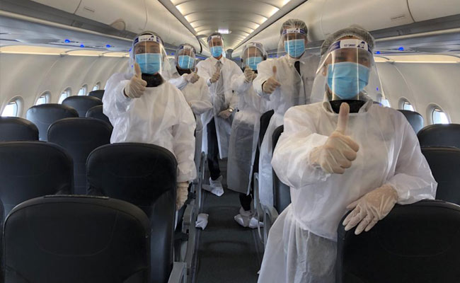 Keep Middle Seats Empty Or Give "Wrap-Around Gowns", Airlines Told