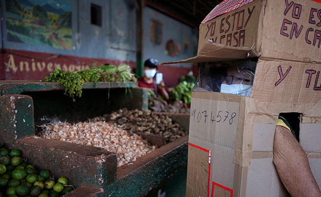 Cuban Woman, 82, Wears Cardboard Box To Shield Herself From Coronavirus