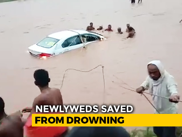 Watch: Locals Jump Into River To Save Newlywed Couple In A Half-Sunk Car