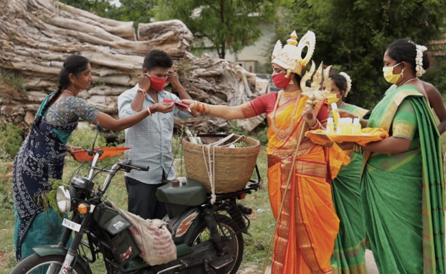 Tamil Nadu Woman Dressed As Goddess Distributes COVID-19 Masks