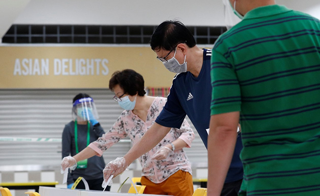 Singapore Residents Wear Masks, Gloves To Vote In Elections Amid Pandemic