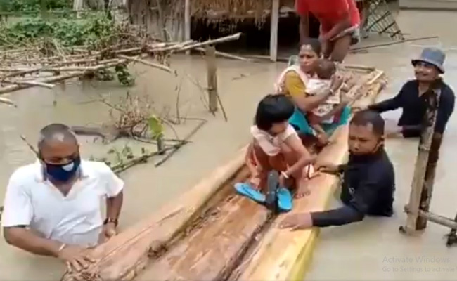 Assam MLA Wades Through Waist-Deep Water To Help Those Stranded In Flood