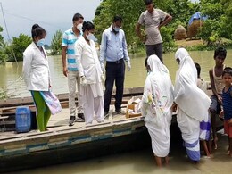 Assam Health Workers "Borrow" Boats To Reach To Flood-Victims Amid COVID Assam Health Workers "Borrow" Boats To Reach To Flood-Victims Amid COVID