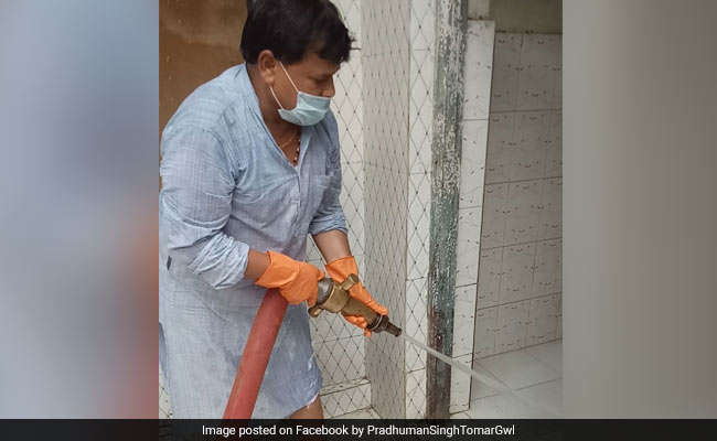 Woman Complains Of Filthy Toilets To Minister. He Cleans It Himself