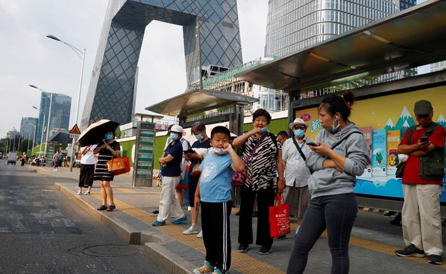 Beijing To Go Mask-Free As Coronavirus Cases Hit New Lows