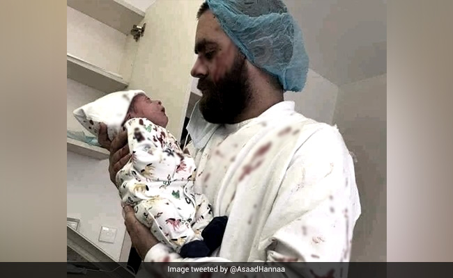 Bloodied Clothes, Newborn In His Arms: Photo Captures Beirut Blast Horror