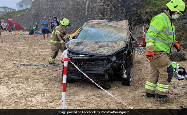 Out-Of-Control Car Plunges Down 20-Foot Cliff, Lands On Busy Beach