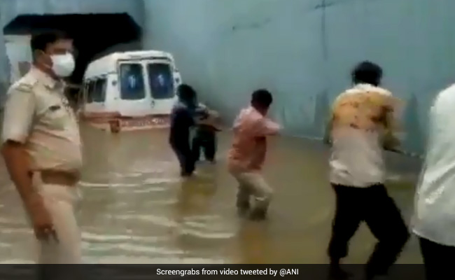 Watch: Locals Pull Out Ambulance Stuck In Waterlogged Underpass In Gujarat
