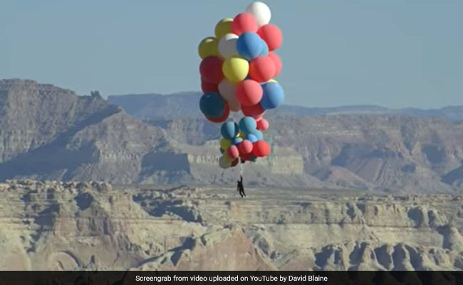 Daredevil David Blaine Flies Into The Sky With 52 Helium Balloons. Watch