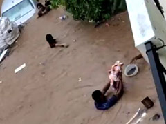 On Camera, Bengaluru Men Save Babies As Heavy Rain Floods Streets