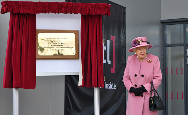 Mask-Free Queen Ventures Outside "HMS Bubble" To Secret Lab