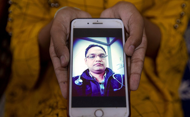Wider Image: The Faces Of India's Covid Pandemic As Deaths Near 100,000
