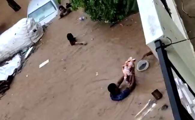 On Camera, Bengaluru Men Save Children As Heavy Rain Floods Streets