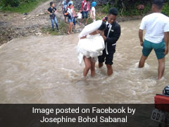 Couple Braves Storm, Wades Through Floodwater To Get Married