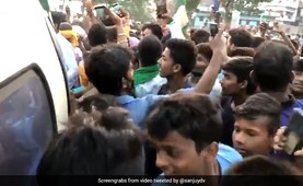 Crowds Around Tejashwi Yadav's Chopper Raise Covid, Security Red Flags Crowds Around Tejashwi Yadav's Chopper Raise Covid, Security Red Flags