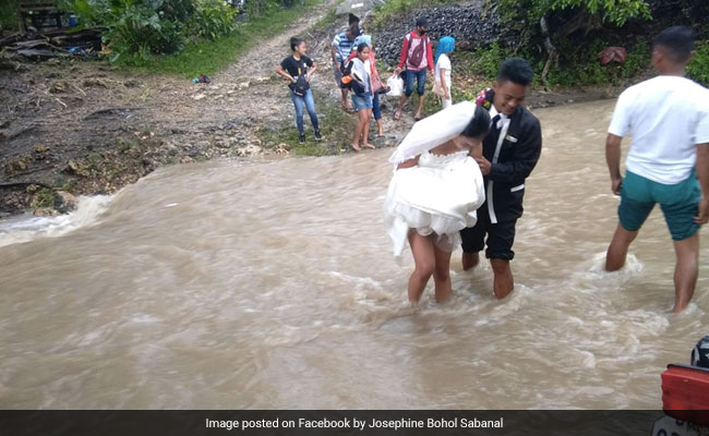 Couple Braves Storm, Wades Through Floodwater To Get Married