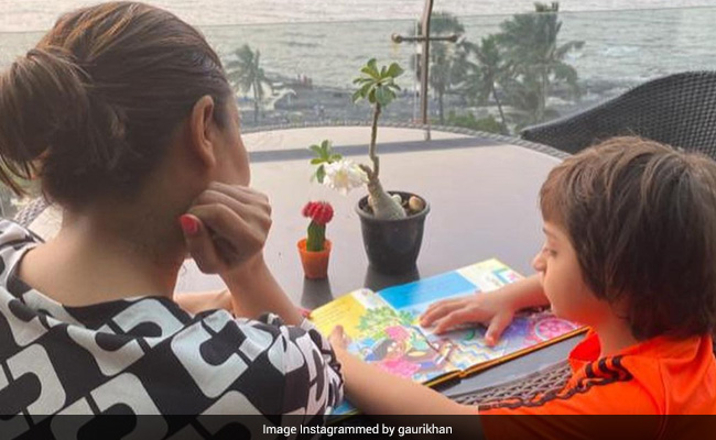 "All Grown Up": Gauri Khan Shares A Pic Of Little AbRam Reading Karan Johar's New Book