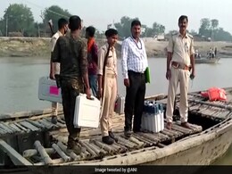 Officials Take Boat To Reach Bihar Polling Booth As VVPAT Develops Glitch Officials Take Boat To Reach Bihar Polling Booth As VVPAT Develops Glitch