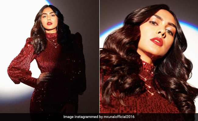 Mrunal Thakur Sparkles With Red Lipstick, Neutral Eye Makeup And A Curly Hairstyle
