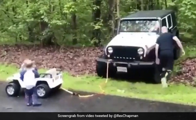 Little Boy 'Helps' Tow His Dad's Car Out Of Ditch In Adorable Viral Video