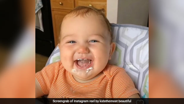Viral: Adorable Baby Can't Stop Laughing While Eating Cream; The Video Will Leave You In Splits