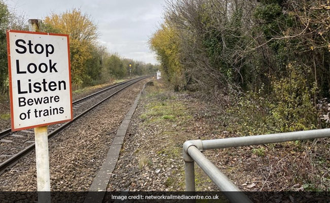 Hair-Raising Video Shows Jogger Nearly Getting Hit By Train
