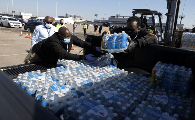 Texas Residents Queue For Drinking Water After Deadly Winter Storm