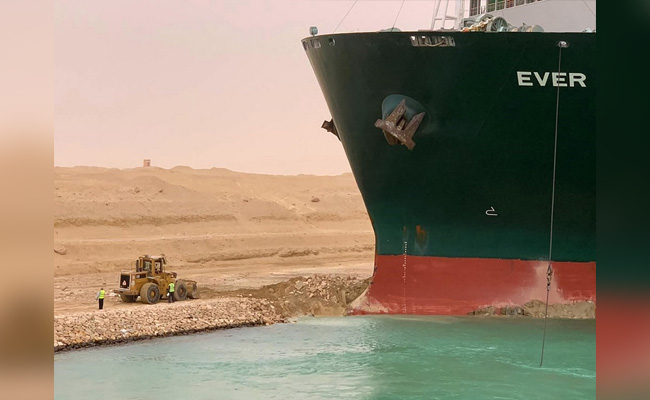 Tiny Bulldozer And A Giant Ship In Suez Canal Inspire Wave Of Memes