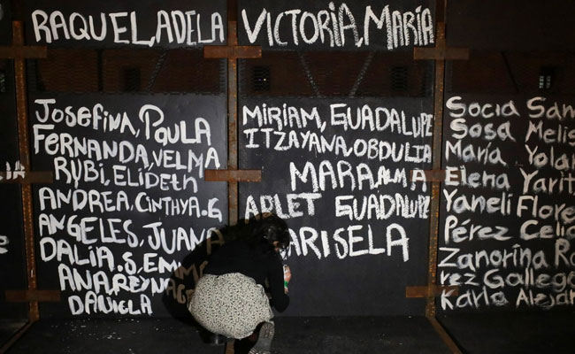 "Victims Of Femicide": Mexico Activists Paint Woman Violence Victims' Names On Barriers