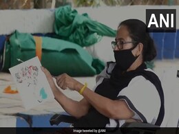 Watch: Banned From Campaigning, Mamata Banerjee Paints In Silent Protest Watch: Banned From Campaigning, Mamata Banerjee Paints In Silent Protest