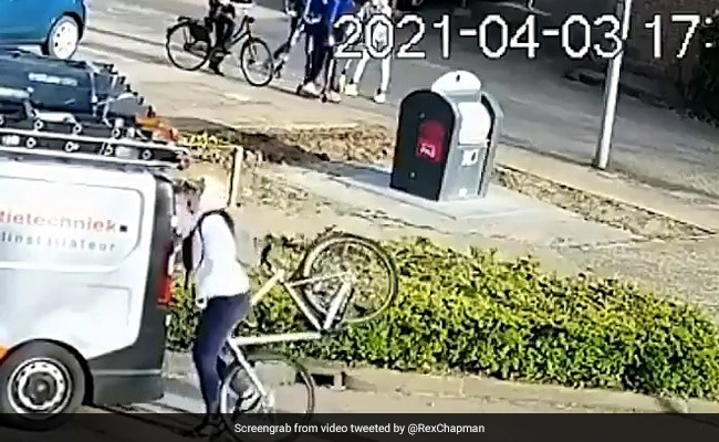 Watch: Busy On Phone, Cyclist Rides Straight Into Parked Van