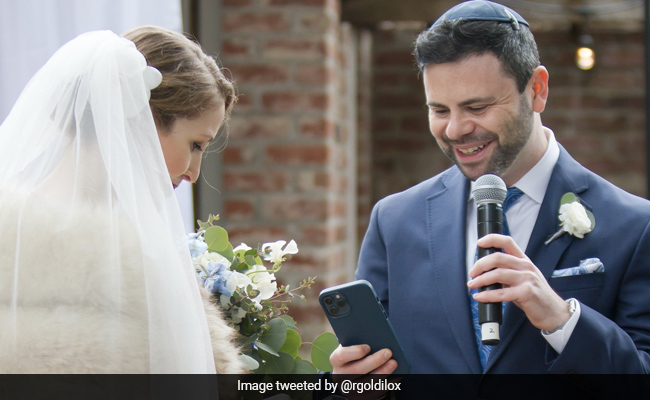 Bride And Groom Exchange NFT Rings During Wedding