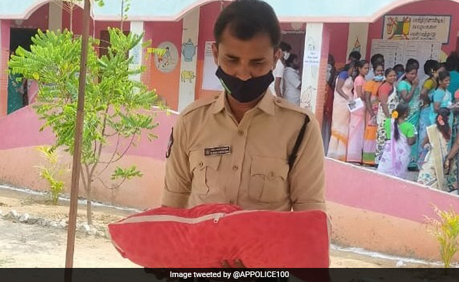 Cop Comforts Crying Baby While Mother Casts Vote In Tamil Nadu. Viral Pic Wins Hearts