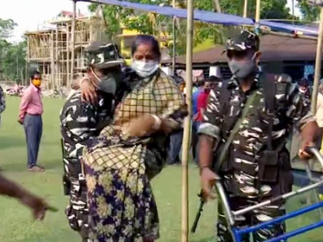Watch: Security Personnel Assist Woman Get To Polling Booth In Bengal