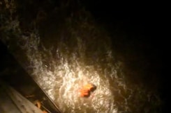 Navy's Searchlights Find Survivors Of Sunken Barge In The Dark Navy's Searchlights Find Survivors Of Sunken Barge In The Dark