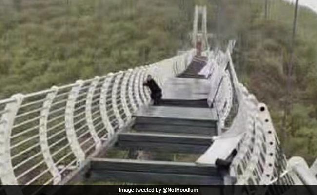 Man Left Dangling From 330-Foot Glass Bridge As Strong Winds Shatter Panels