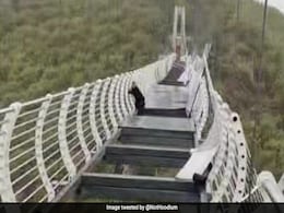 Man Left Dangling From 330-Foot Glass Bridge As Strong Winds Shatter Panels Man Left Dangling From 330-Foot Glass Bridge As Strong Winds Shatter Panels