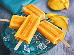 Mango Popsicle Dipped In Dark Chocolate: Beat The Heat With This Chilled Dessert Mango Popsicle Dipped In Dark Chocolate: Beat The Heat With This Chilled Dessert