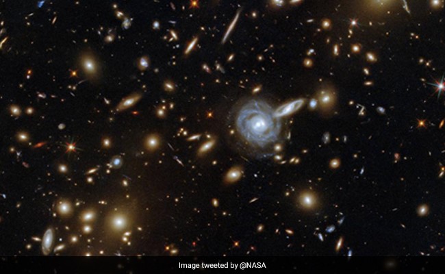 "Time To Peer Into The Universe": NASA's Stunning Image Of Galaxy Cluster