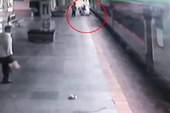 Man Slips Trying To Board Moving Train, Cop Saves Him Man Slips Trying To Board Moving Train, Cop Saves Him