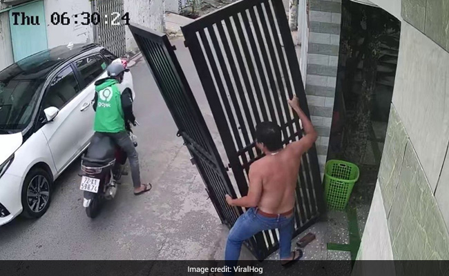 Video: Close Shave For Bike Rider As Iron Gate Nearly Falls On Him