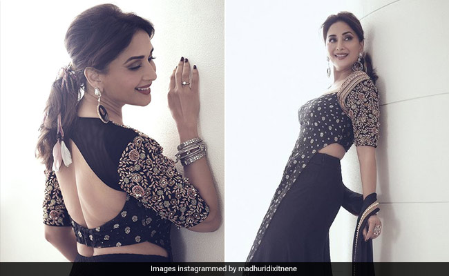 Madhuri Dixit Weaves Ethnic Magic In A Black And Gold Embroidered <i>Sharara</i> Suit