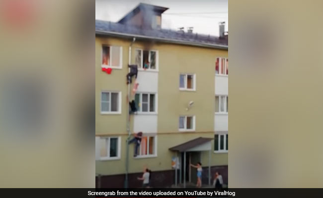 Video: In Heroic Rescue, Russians Climb Pipe To Save Children From Fire