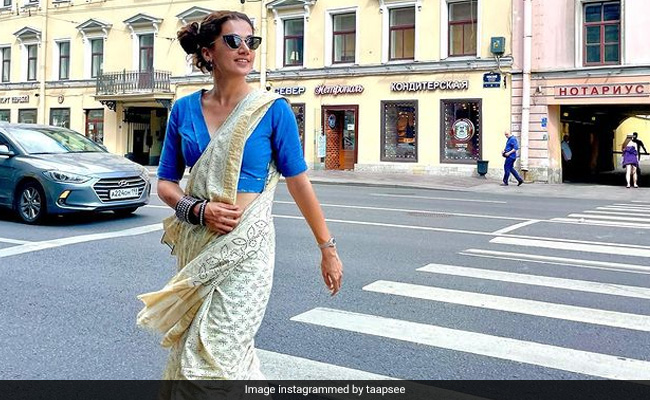 Taapsee Pannu Takes Over Saint Petersburg In Style Wearing A Printed <i>Saree</i> With Sneakers