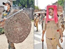 UP Cop Uses Plastic Stool As Riot Gear, Bosses Demand Explanation UP Cop Uses Plastic Stool As Riot Gear, Bosses Demand Explanation
