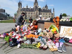 Justin Trudeau Lays Flowers At Makeshift Memorial For Indigenous Students