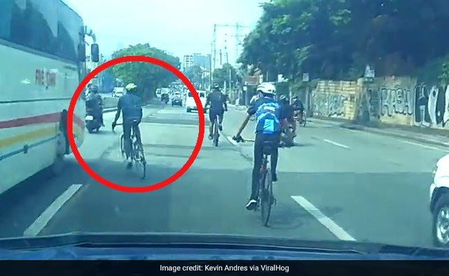 Caught On Camera: Oblivious Bicyclist Bumps Into Bus